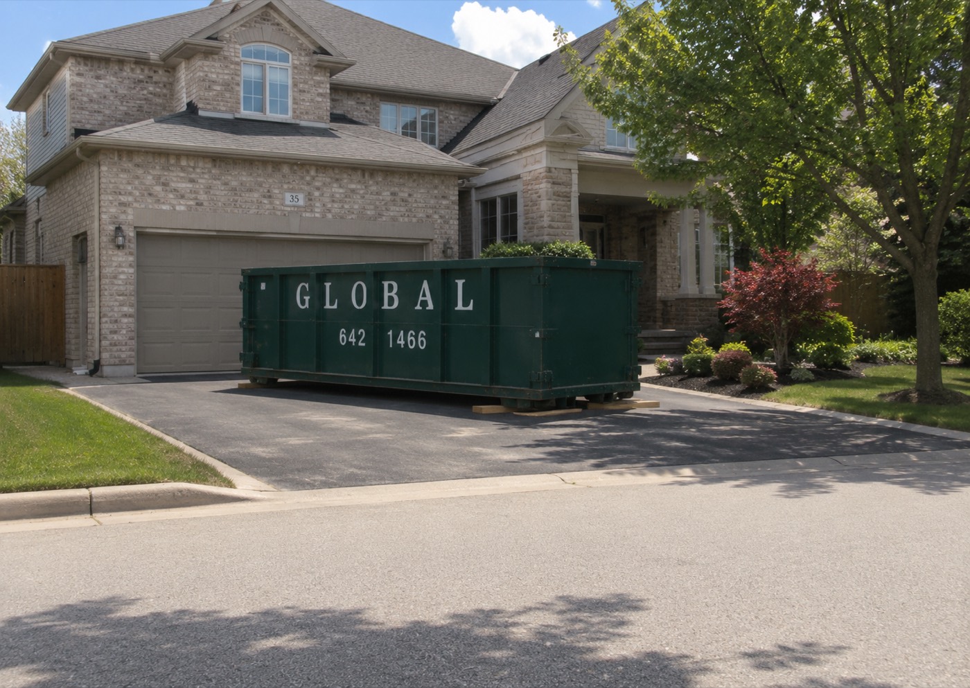 Global Waste Removal bin rental delivered to a residential driveway